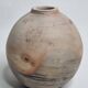 Round ceramic vase with raw finish, smoked firing, signed, late 20th century, 11 cm.