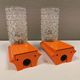 Bathroom lamps in a nice orange colour with a crystal glass shade and a base of hard thin plastic
