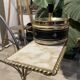 Gold wrought iron ashtray on legs with magazine rack and marbled shelf