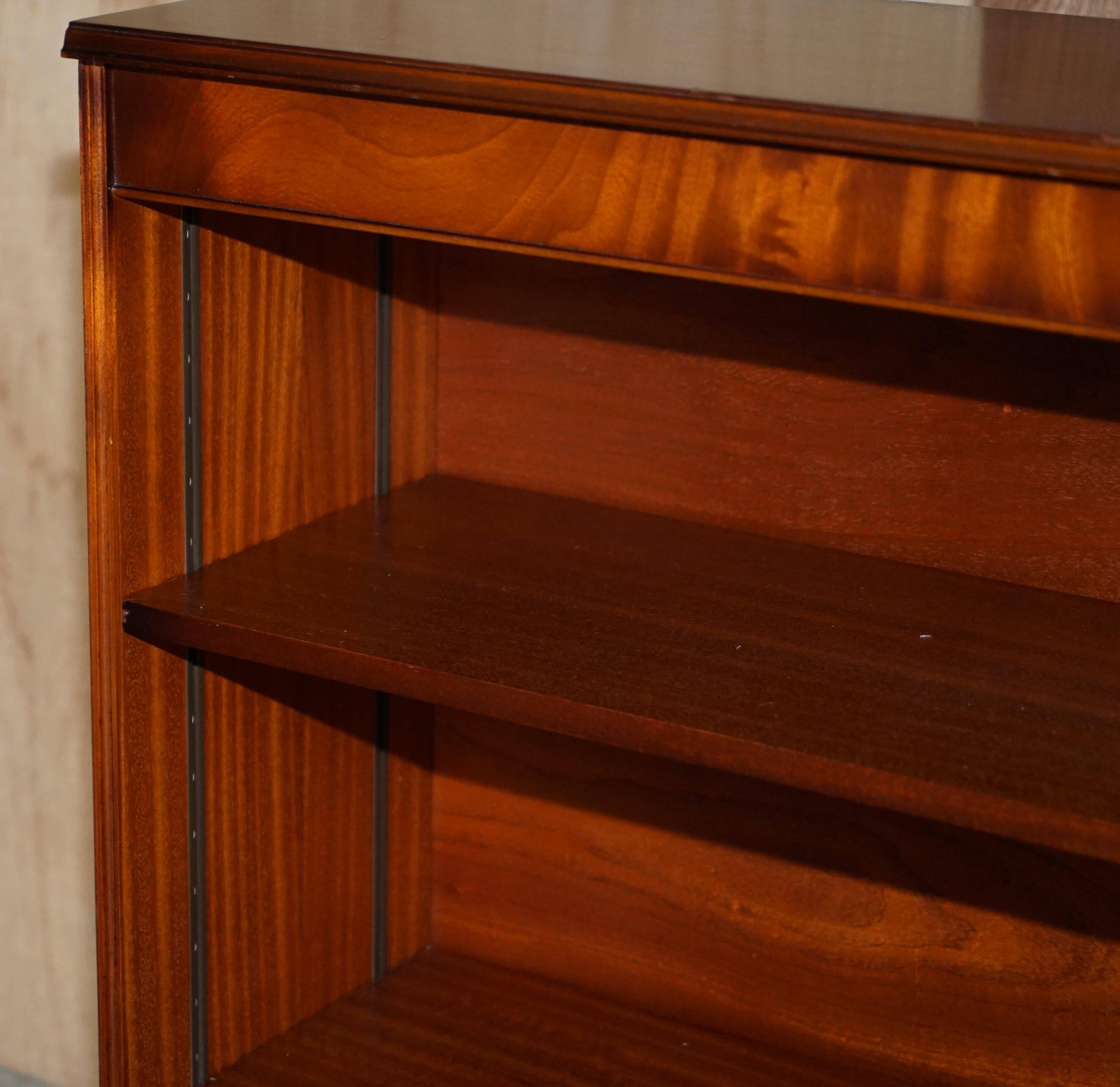 Pair of open dwarf bookshelves in mahogany by Shaws of London.