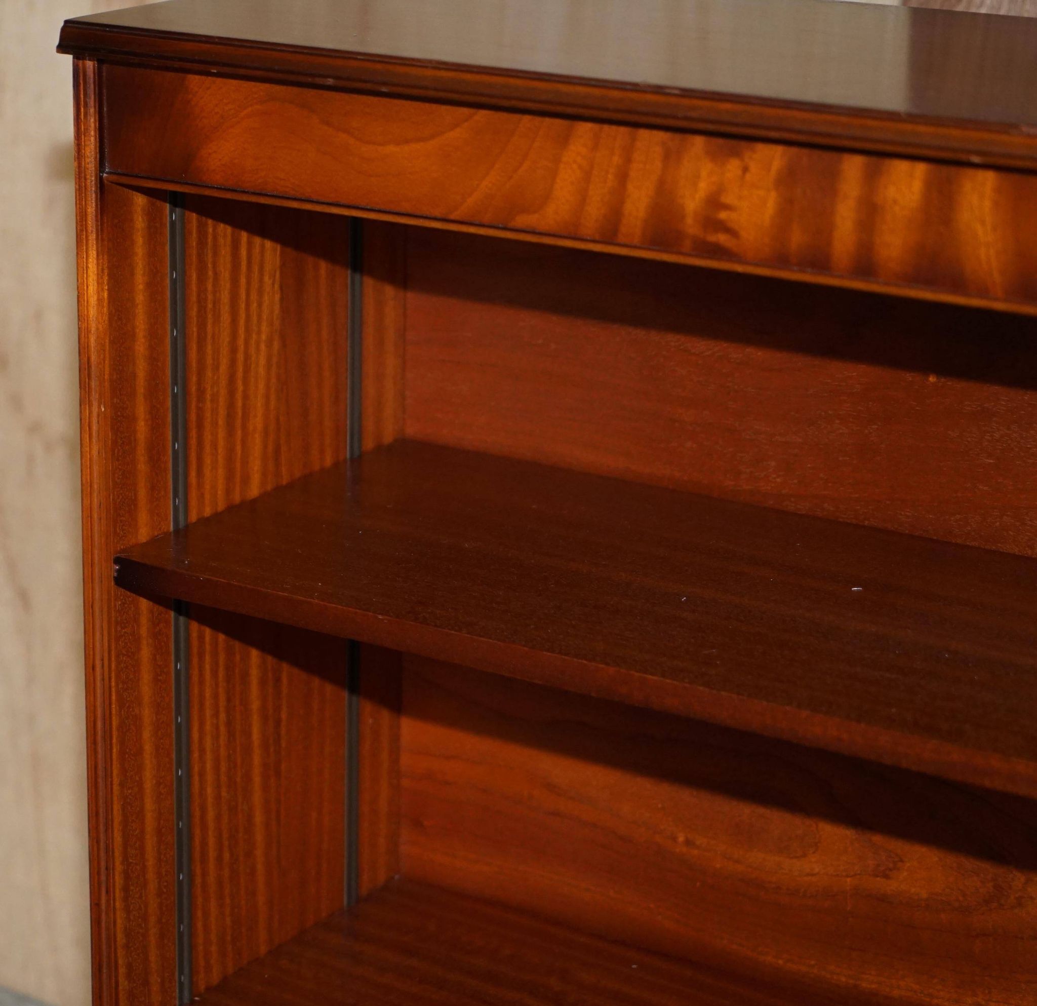Pair of open dwarf bookshelves in mahogany by Shaws of London.
