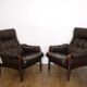 Pair of Scandinavian leather armchairs with ottomans 1970