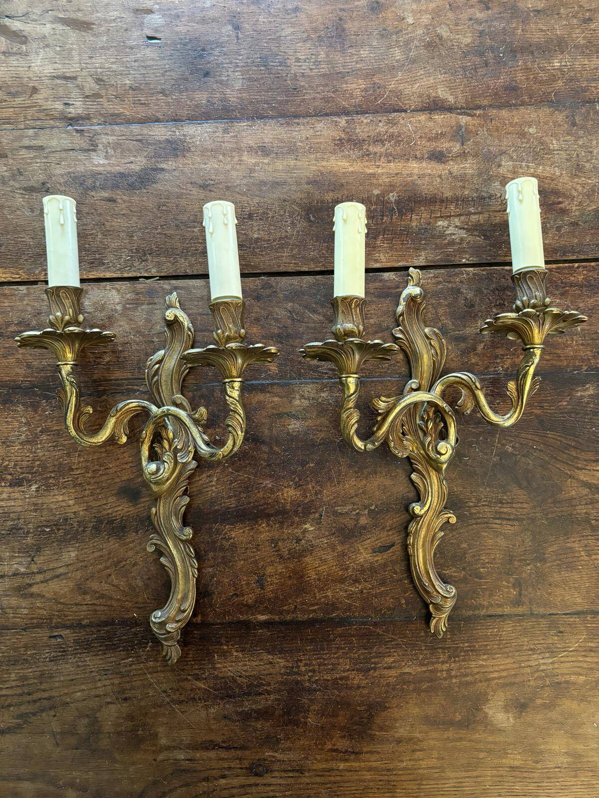 Pair of Louis XV Style wall lights in gilded bronze