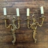 Pair of Louis XV Style wall lights in gilded bronze