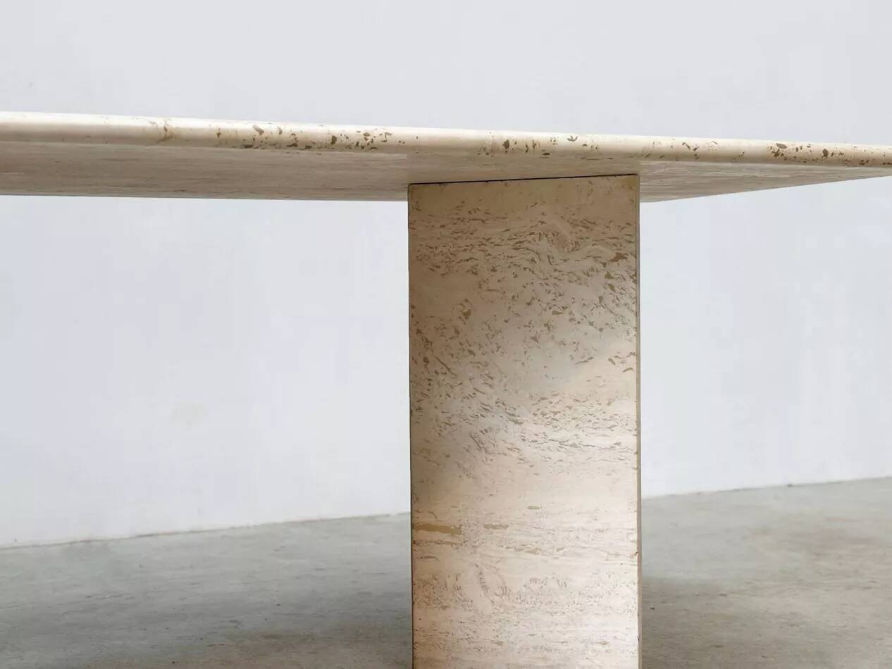 Sculptural travertine dining table