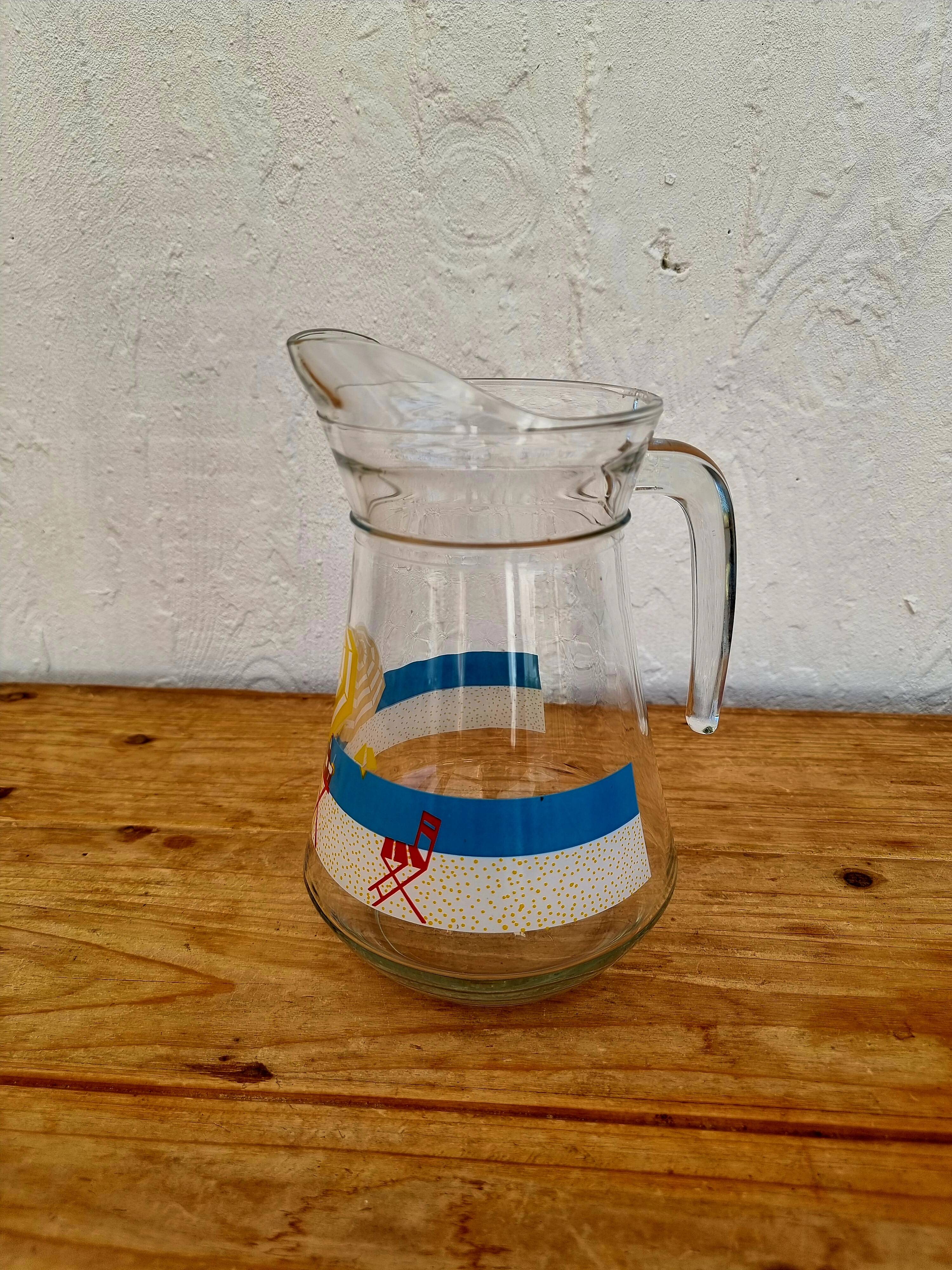 Vintage glass pitcher with summer decor