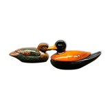 Enamelled terracotta boxes in the shape of ducks.