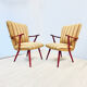A pair vintage cocktail chairs with stripes and metal screws