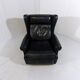 Fauteuil à oreilles en cuir noir sur roulettes années 1960