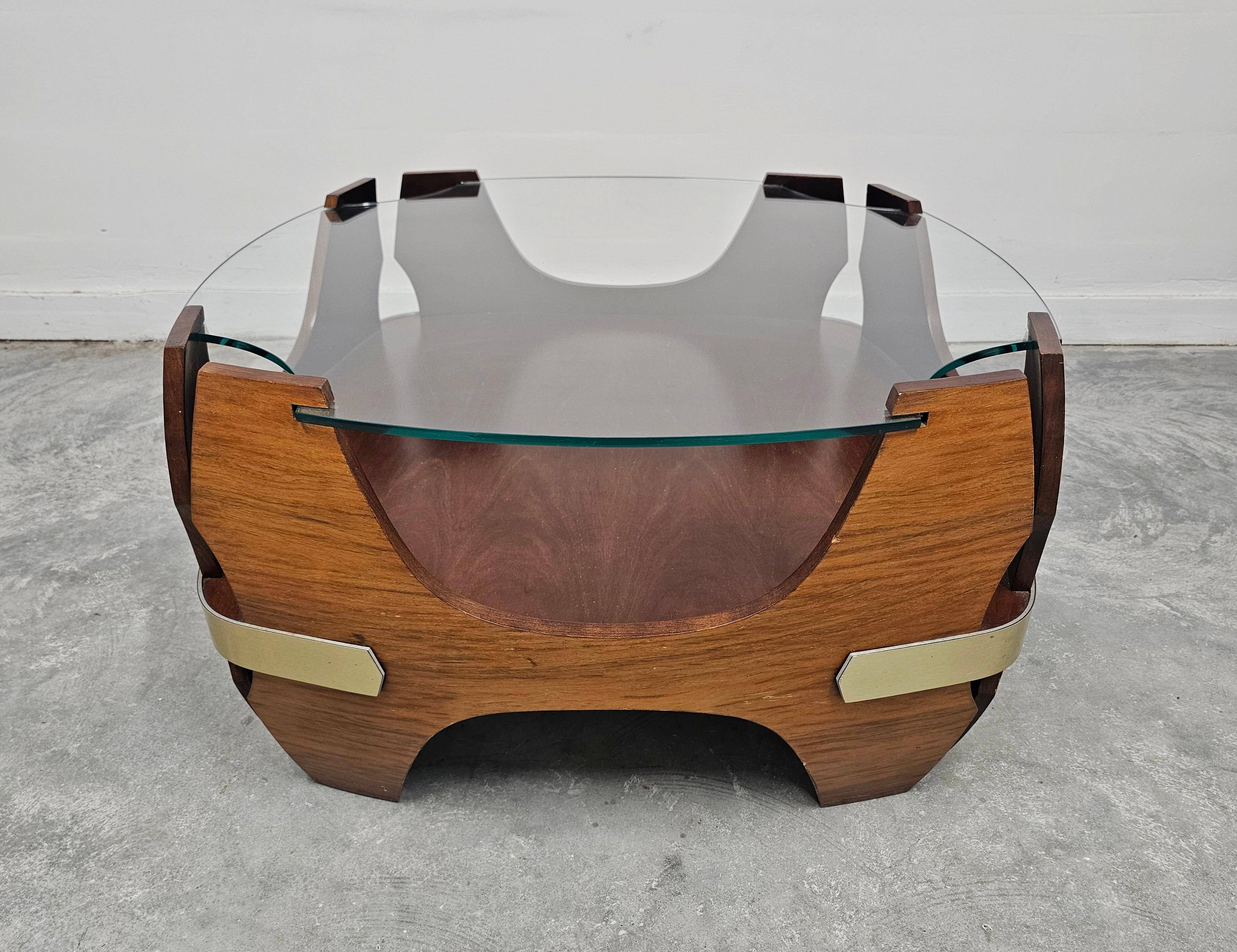 Mid-century coffee table in curved plywood with a glass top, 1940s.
