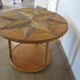 Round coffee table in bamboo, rattan, and wood with an 80s star pattern.
