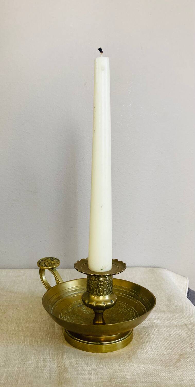 20th century chiseled brass socket candle holder representing Horsemen in armor