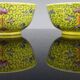 Pair of porcelain bowls and spoons "Famille Rose" China, early 20th century.