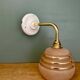 Vintage pink and gold frosted glass globe wall light.