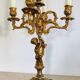 Solid bronze candlesticks decorated with putti, acanthus leaves and lion heads