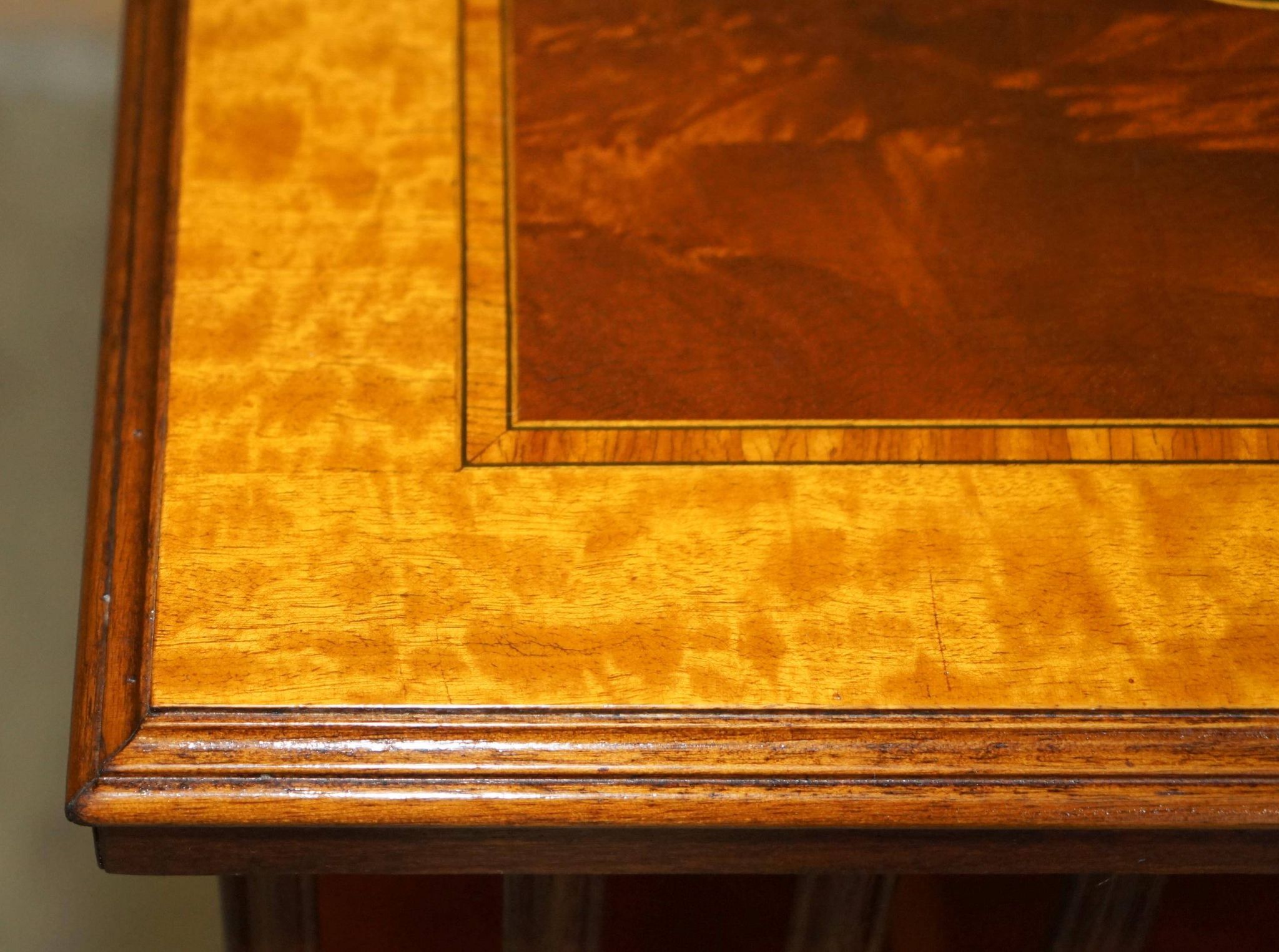 Sheraton Revival rotating library table in walnut and satin wood.
