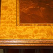 Sheraton Revival rotating library table in walnut and satin wood.