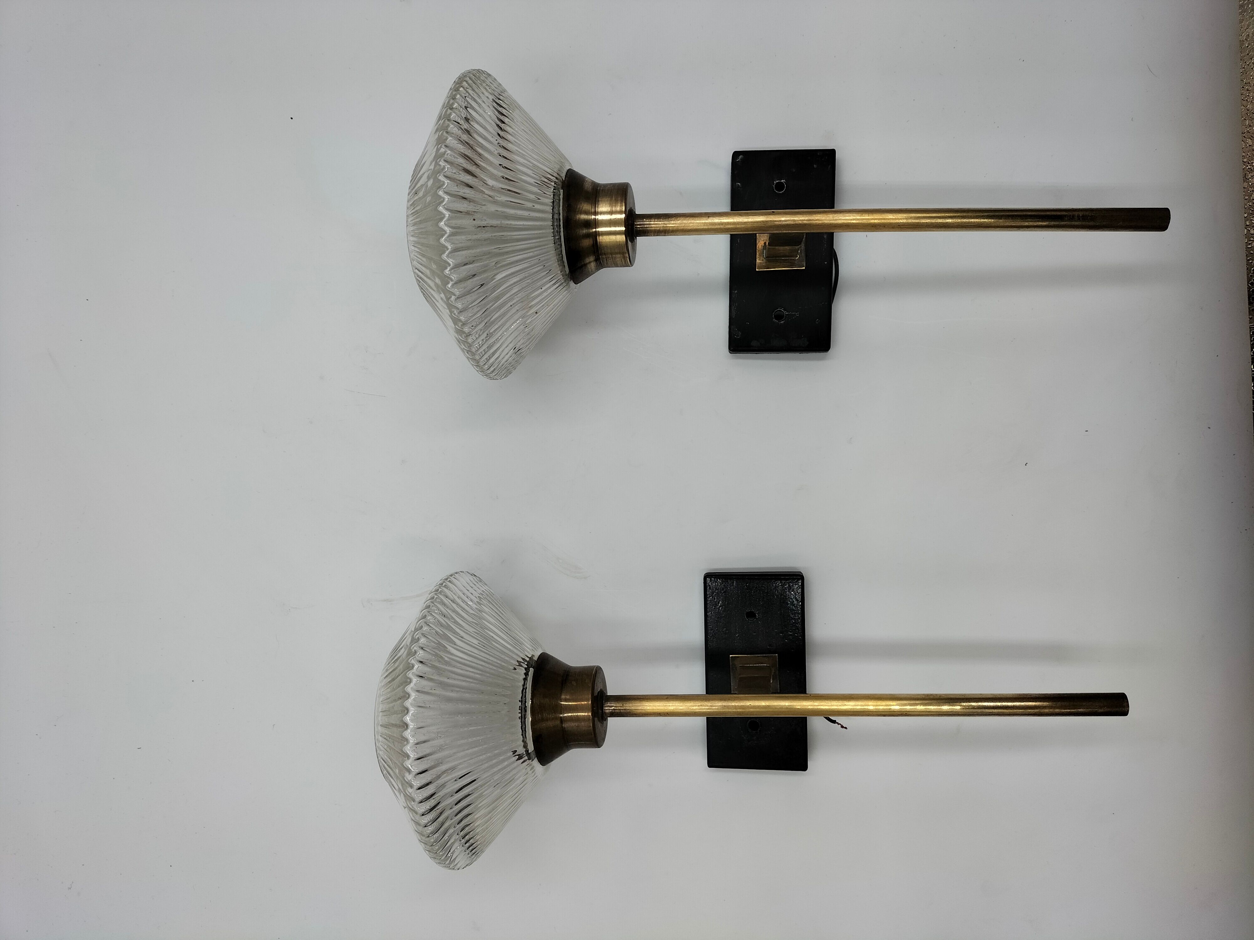 Pair of brass and glass wall lamps