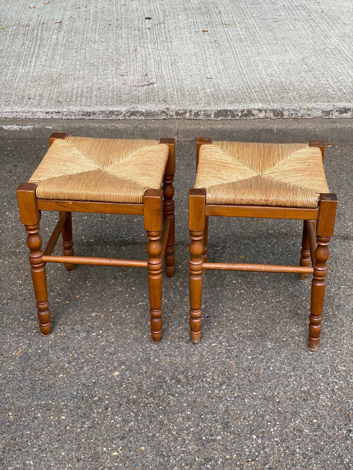 2 square stools made of carved solid wood with rush seats from the 1970s.