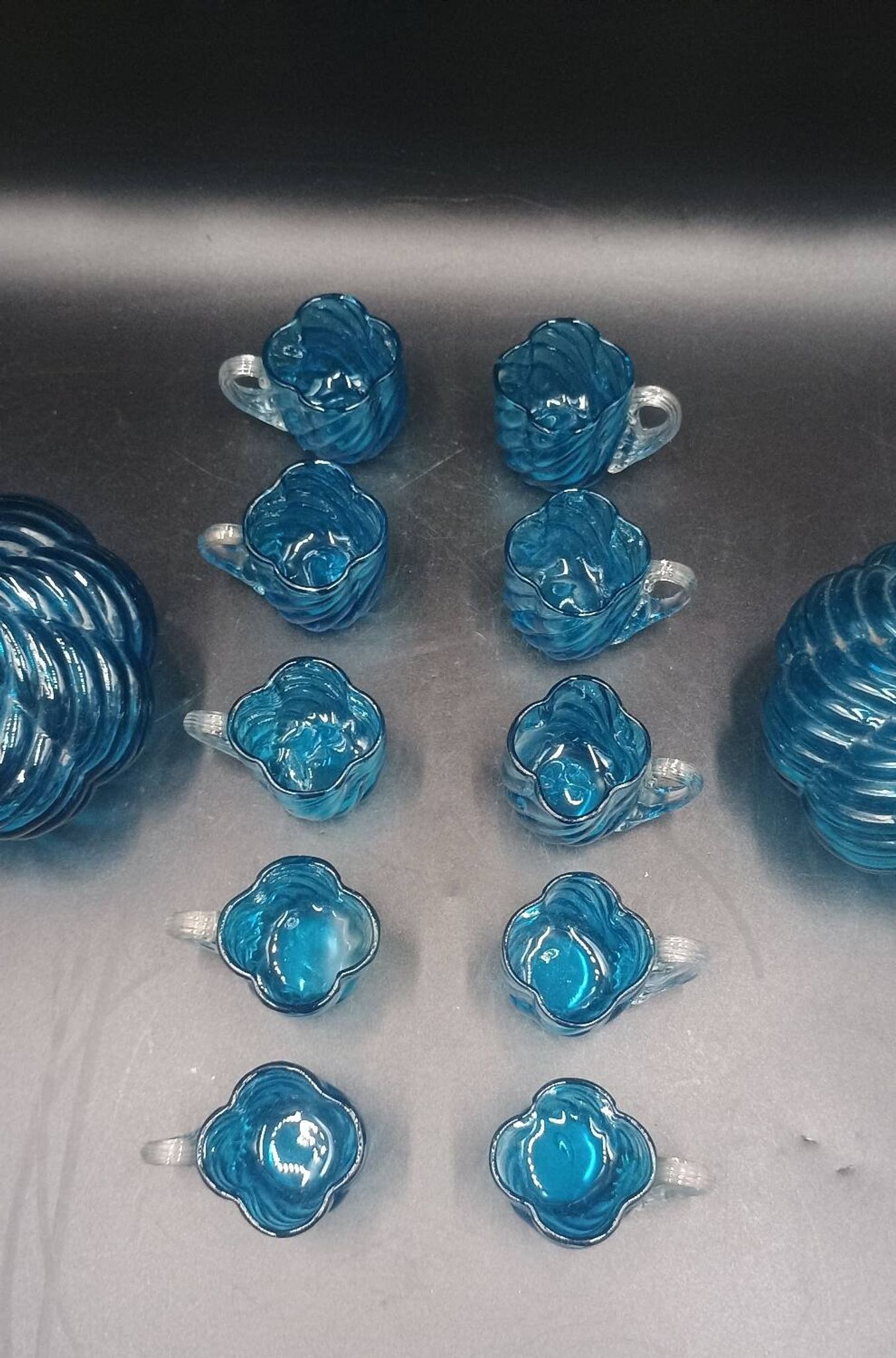 Cabaret Portieux liqueur service with 10 blue and clear glasses.