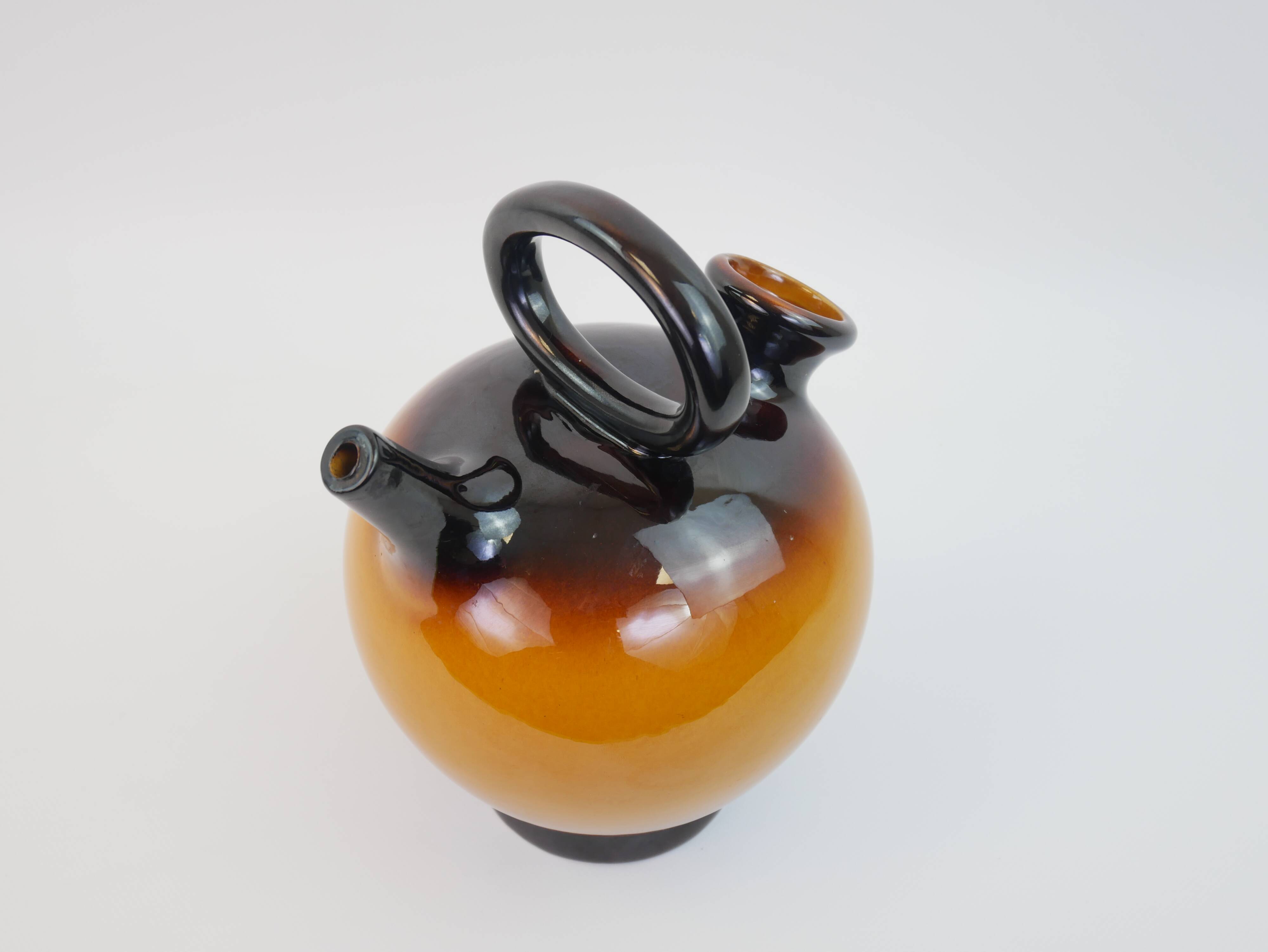 Ochre-orange ceramic jug signed under the base CP Claude Paci