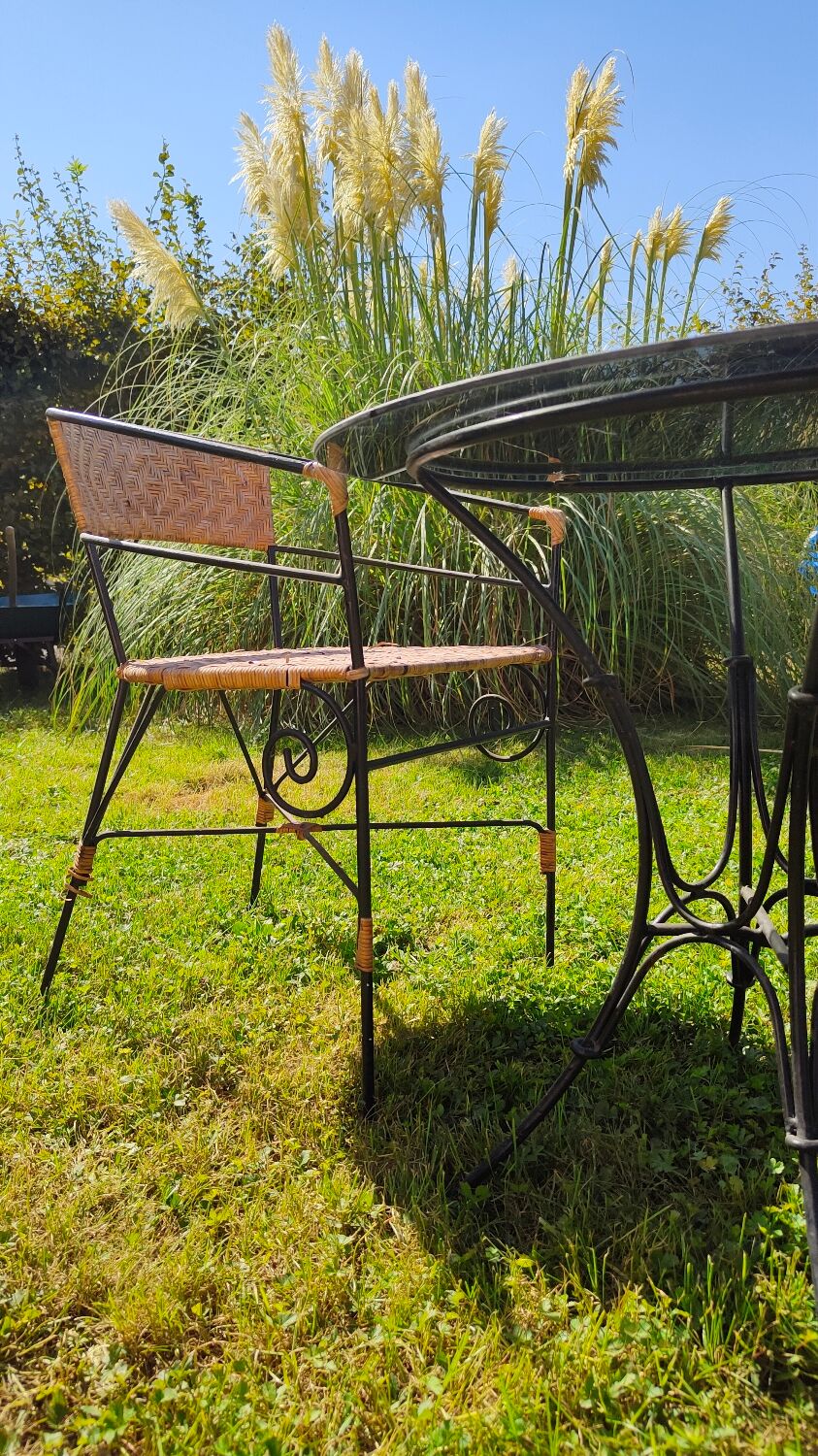 Garden table and wrought iron chair