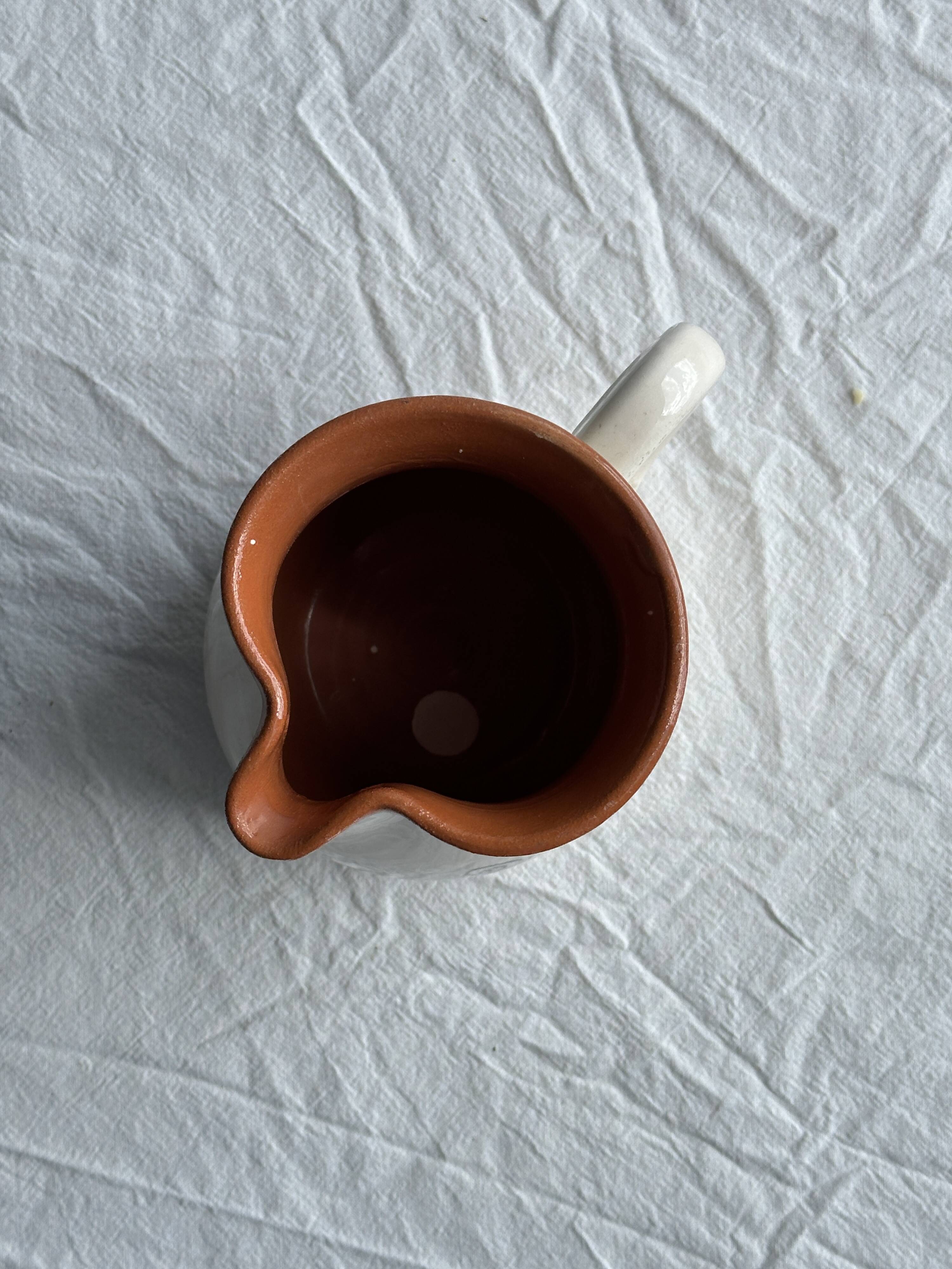 Small handmade white and ocher earthenware pitcher Sifnos Apostolidis Hand Made