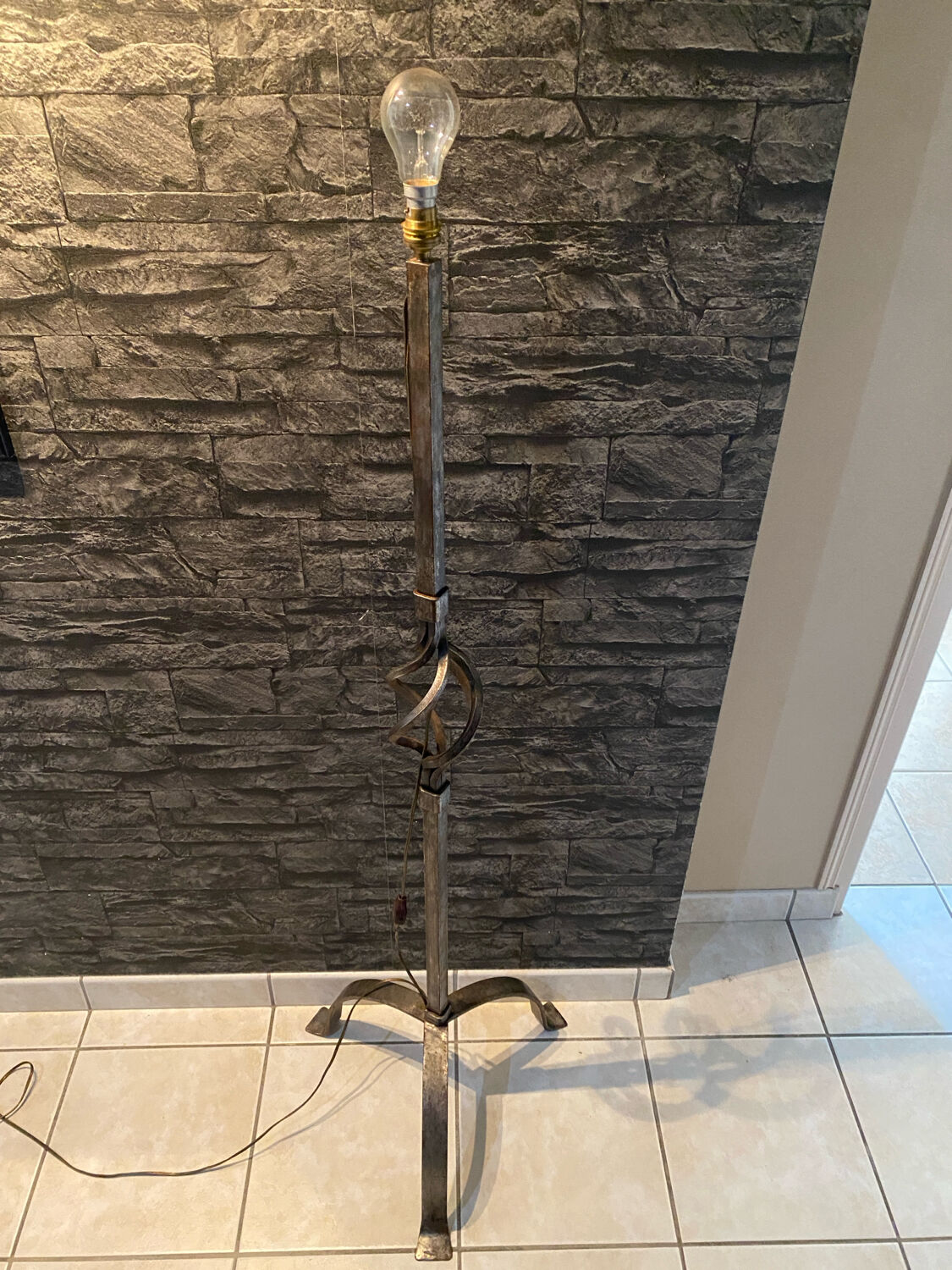 Brutalist tripod floor lamp in wrought iron