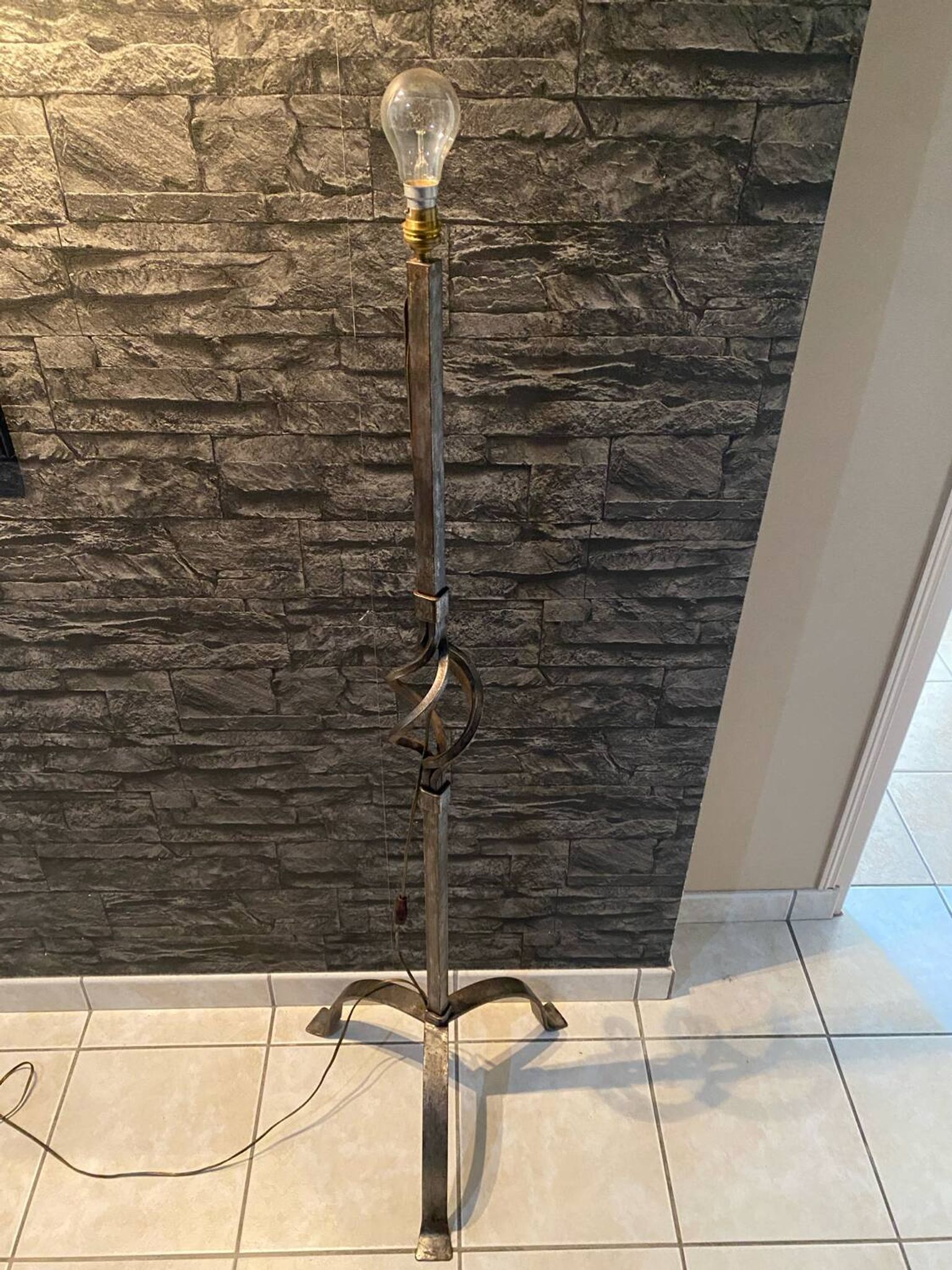 Brutalist tripod floor lamp in wrought iron