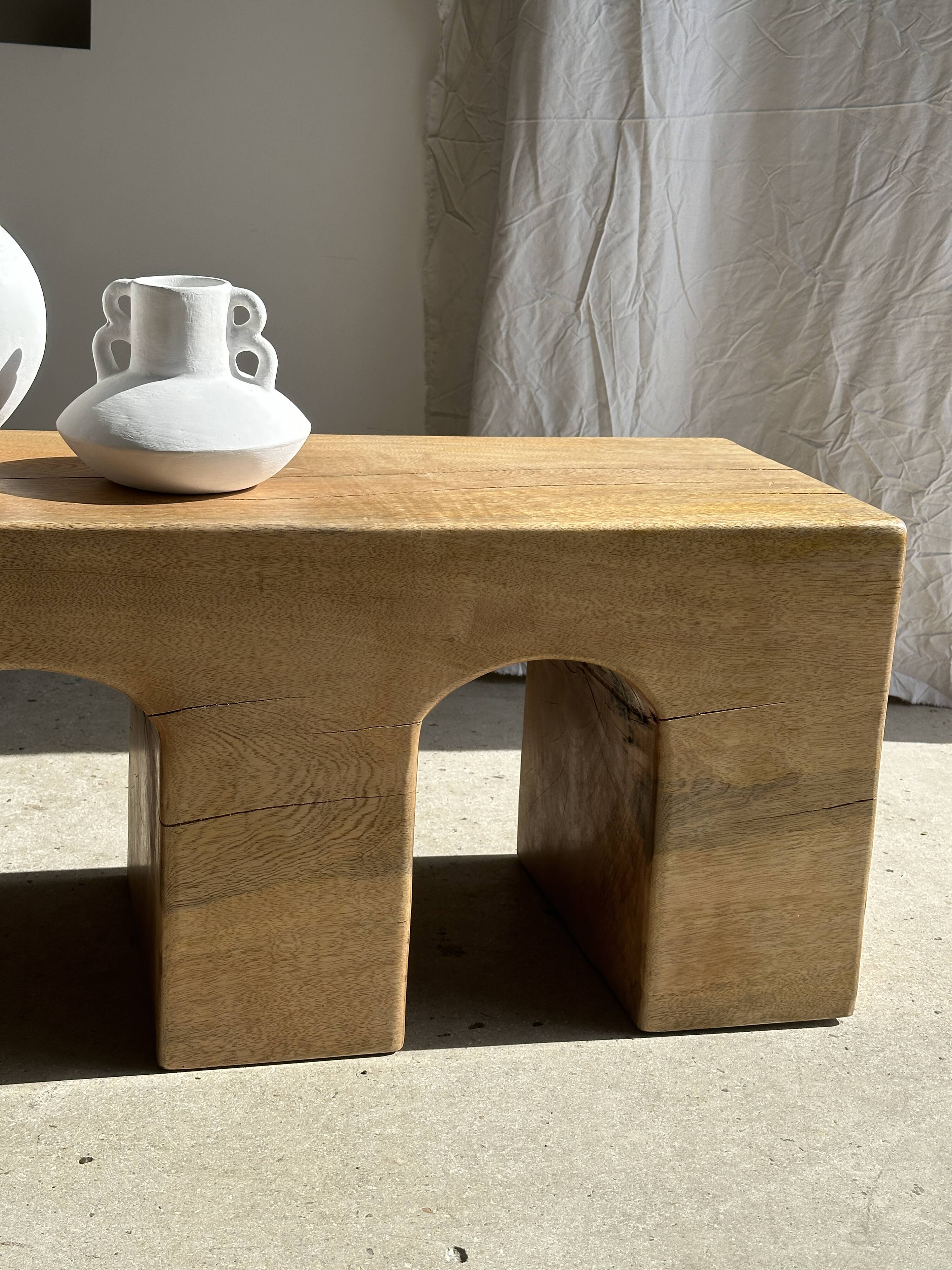 Solid monoxyl wood bench with carved 3-arch base - Natural wood color