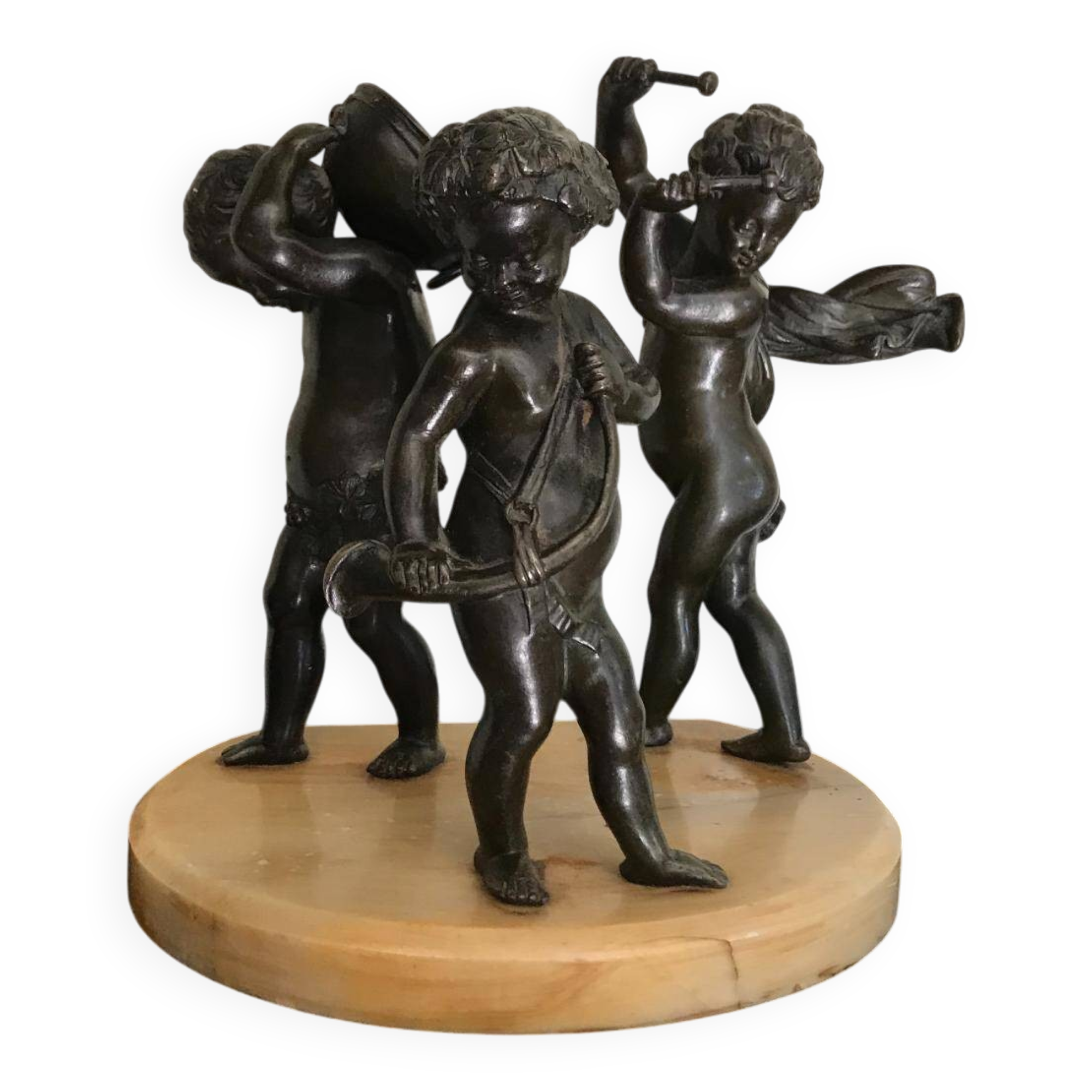 Three musician angels, bronze sculptures on a marble base.