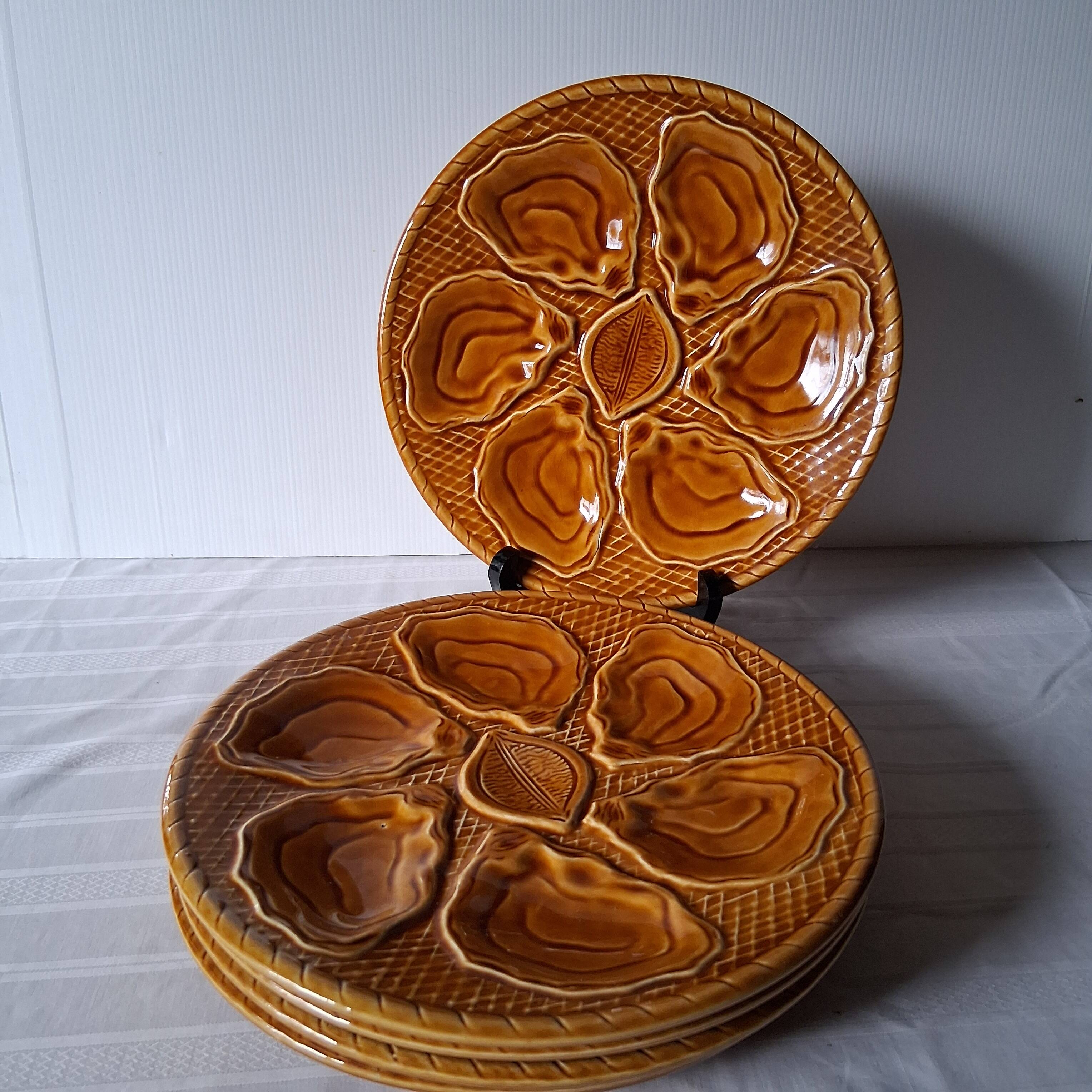 5 oyster or brown shell plates in good condition