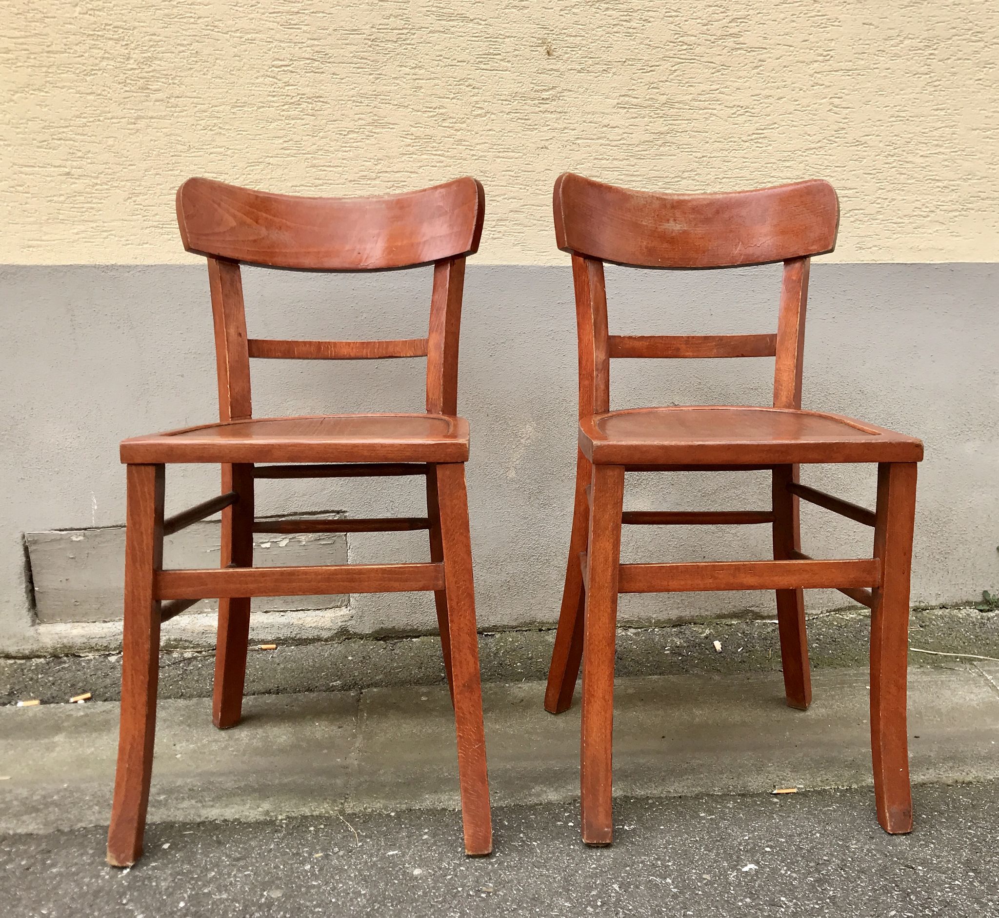Pair of wooden bistro chairs with orange patina, 1950s