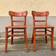 Pair of wooden bistro chairs with orange patina, 1950s