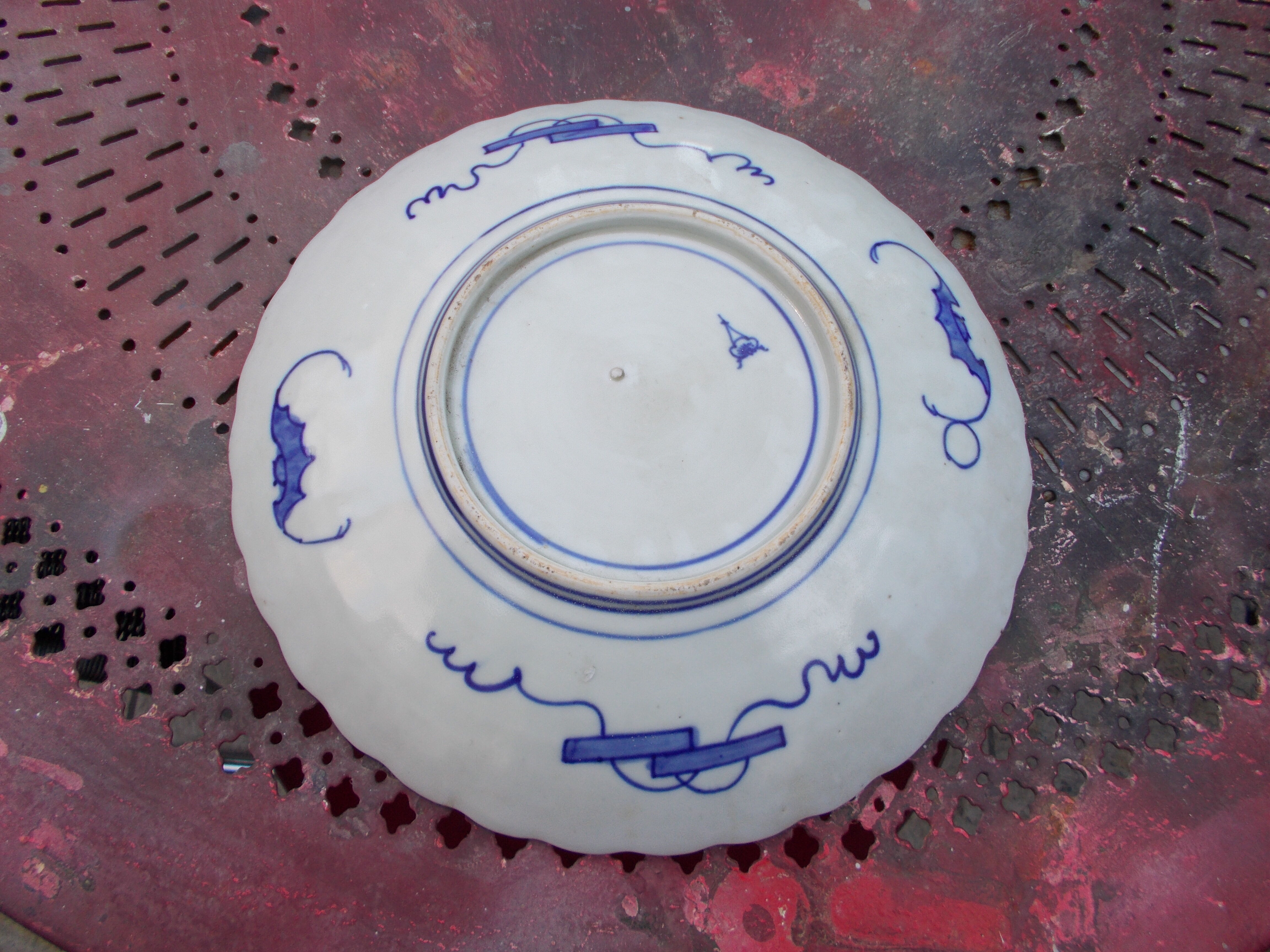 Ancient round porcelain dish from Japan Imari