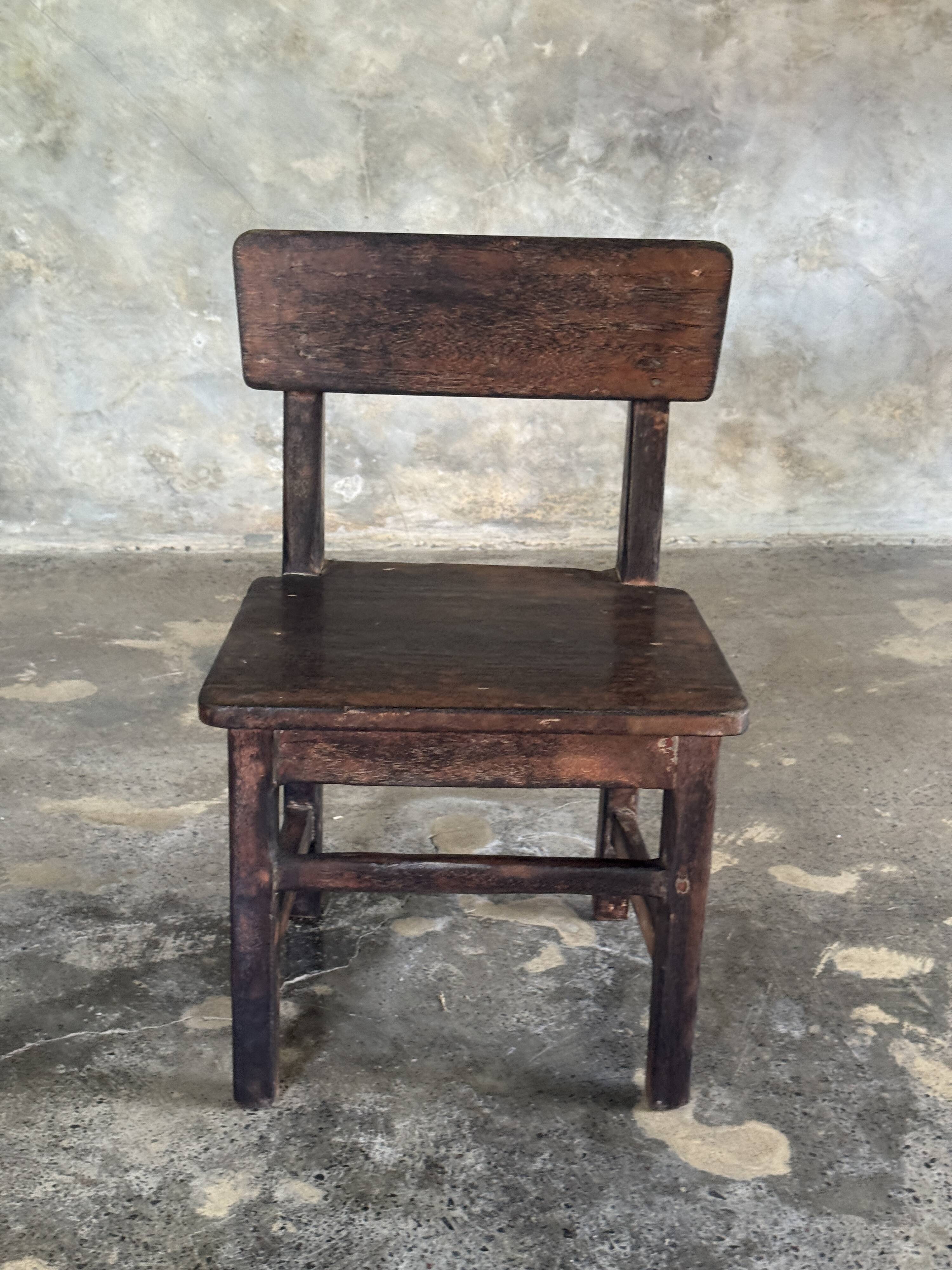 Small antique Indonesian children's chair in teak.