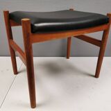 Danish designed footstool in teak wood and black skai “imitation leather”