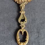 Antique hand-facing mirror in bronze and beveled glass