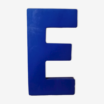Letter E vintage sign in blue plexiglass
