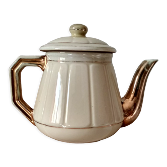 Teapot in yellow and gold earthenware