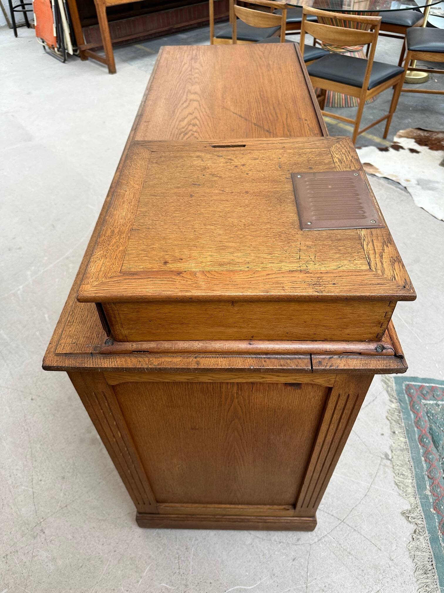 Oak cash register counter from the early 20th century