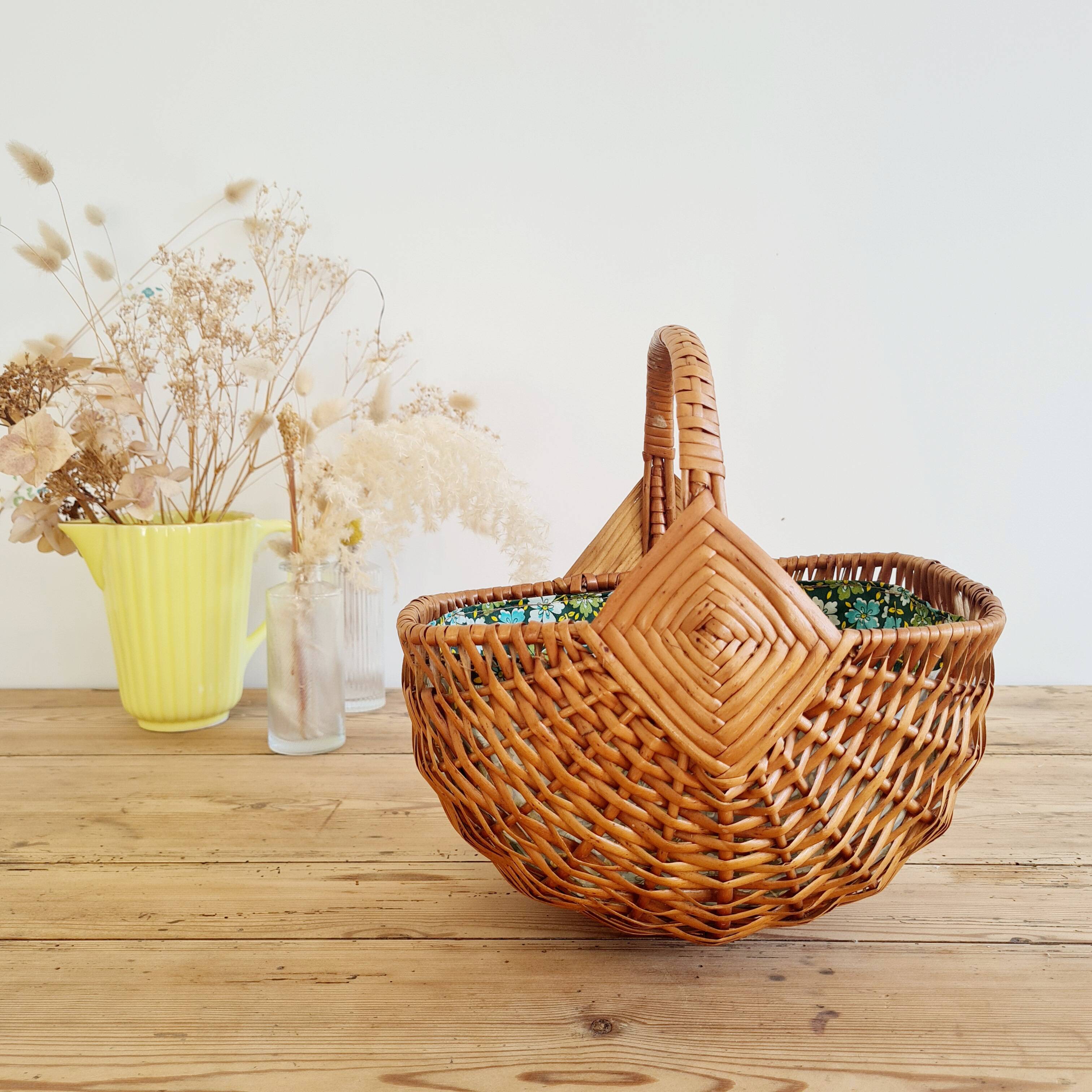 Small old basket with floral fabric interior