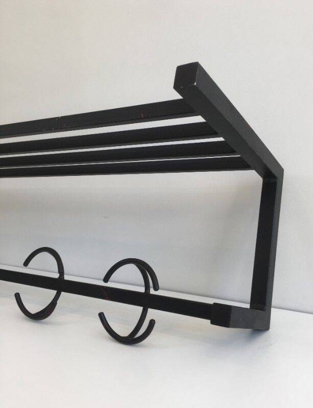 Designer coat rack in blackened metal