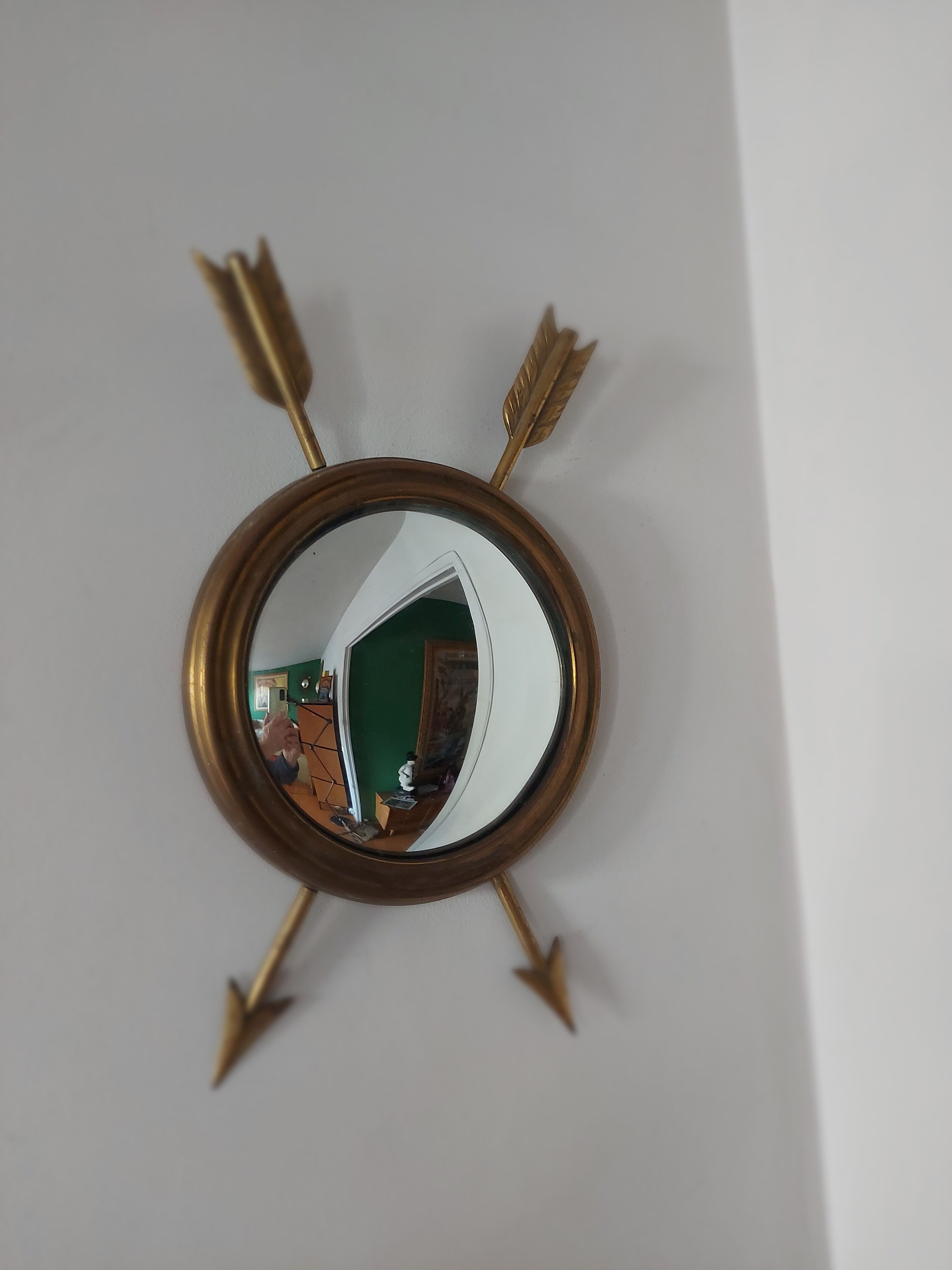 Curved brass witch's mirror