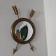 Curved brass witch's mirror