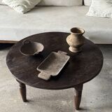 Coffee table, round antique Indonesian teak table with straight legs.