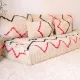 Handmade Azilal rug sofa 180 cm with soft cushions.