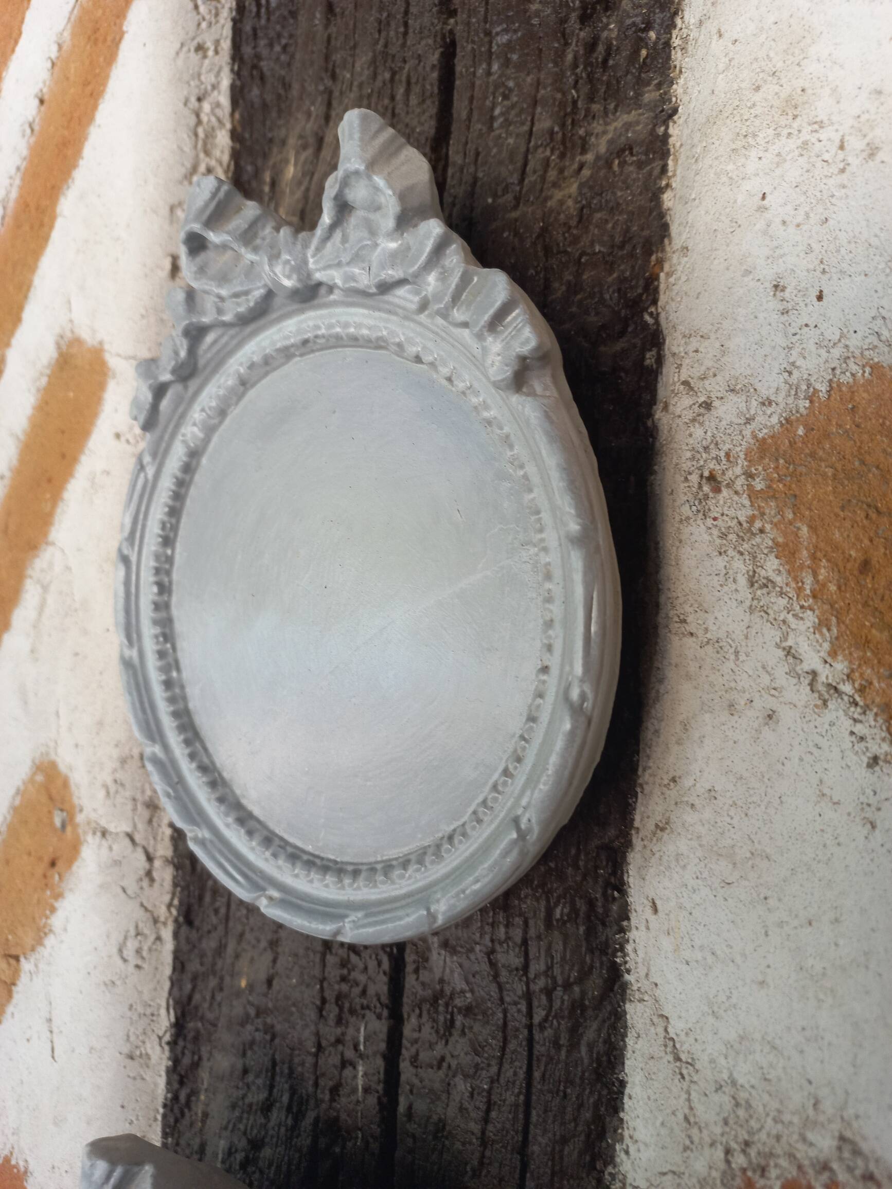 Pair of gray patinated plaster frames