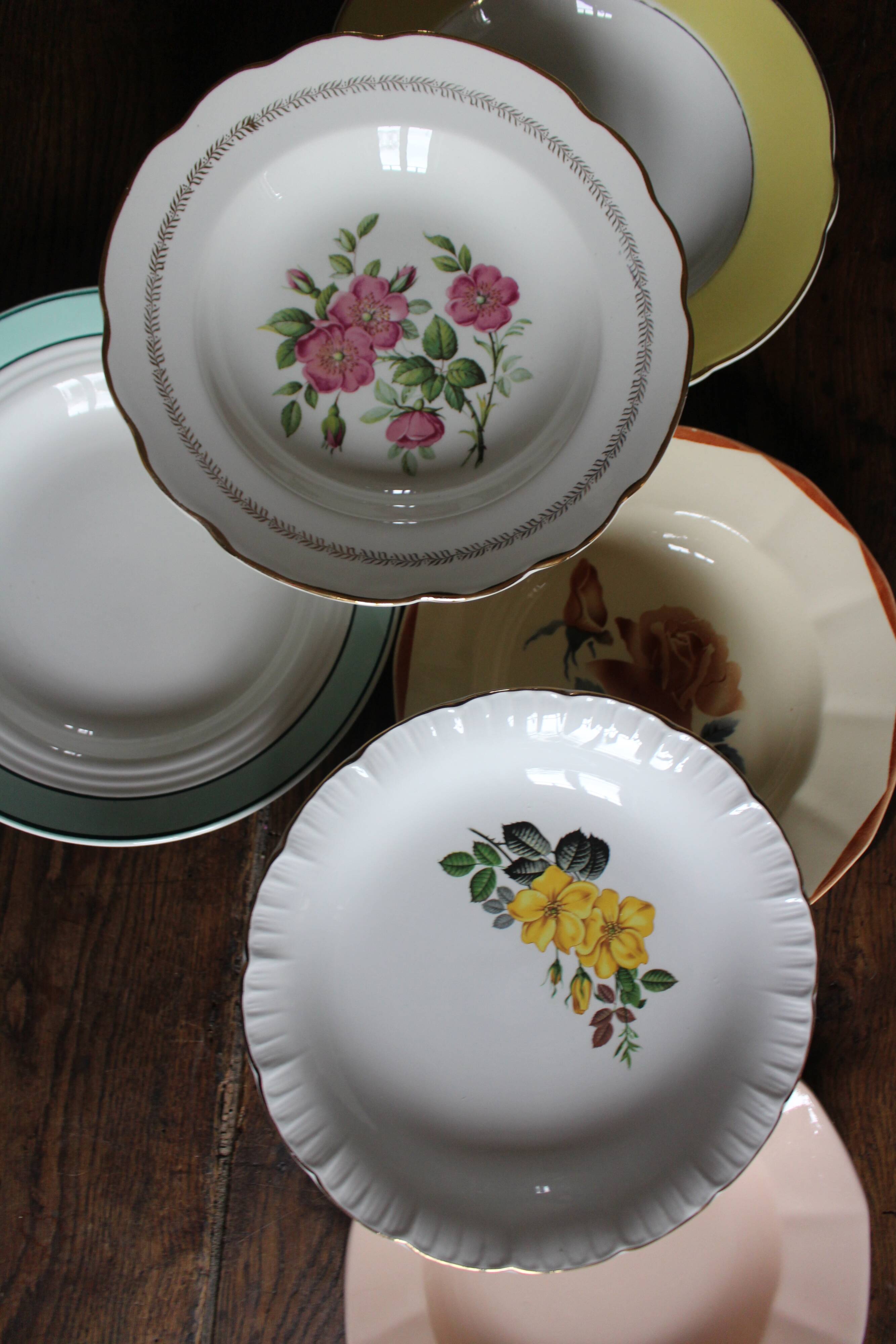 6 mismatched deep plates in floral colours from Digoin, Sarreguemines, Gien.