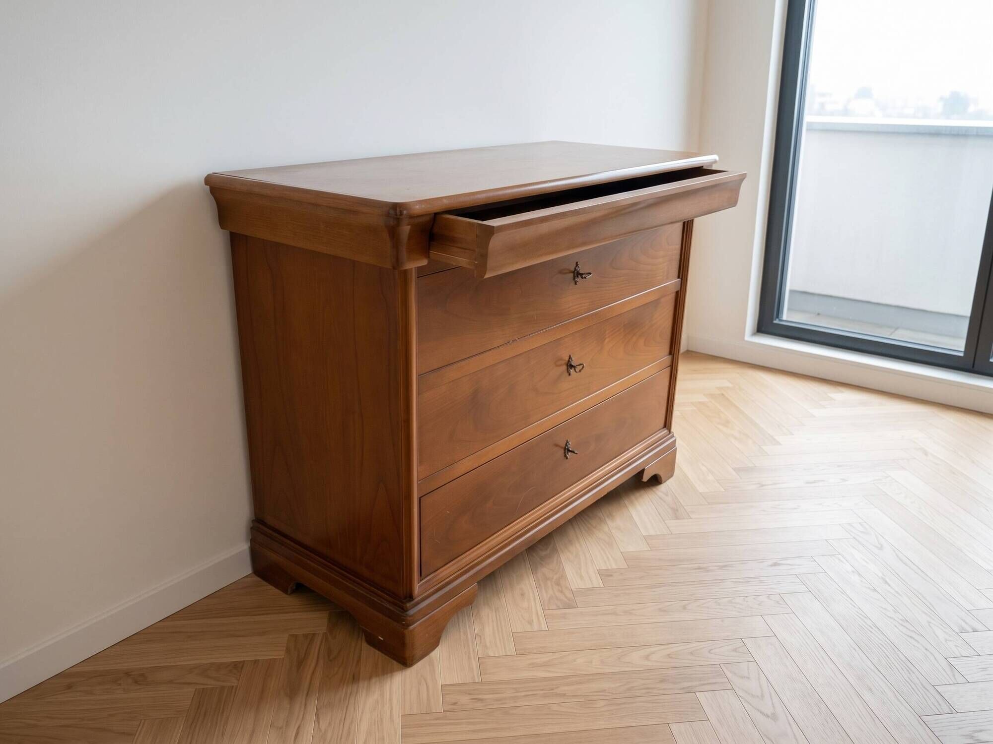Antique solid wood chest of drawers with a secret drawer.